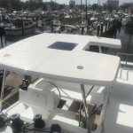 Boat canopy providing shade over the cockpit area.