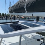 Solar panels installed on a boat's roof at the marina.