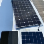 Solar panels installed on a rooftop under clear skies.