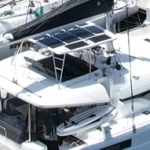 Sailboat equipped with solar panels on the deck.